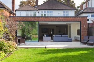 Aerial view of a modern suburban house in Fuquay-Varina with a well-maintained lawn and driveway.